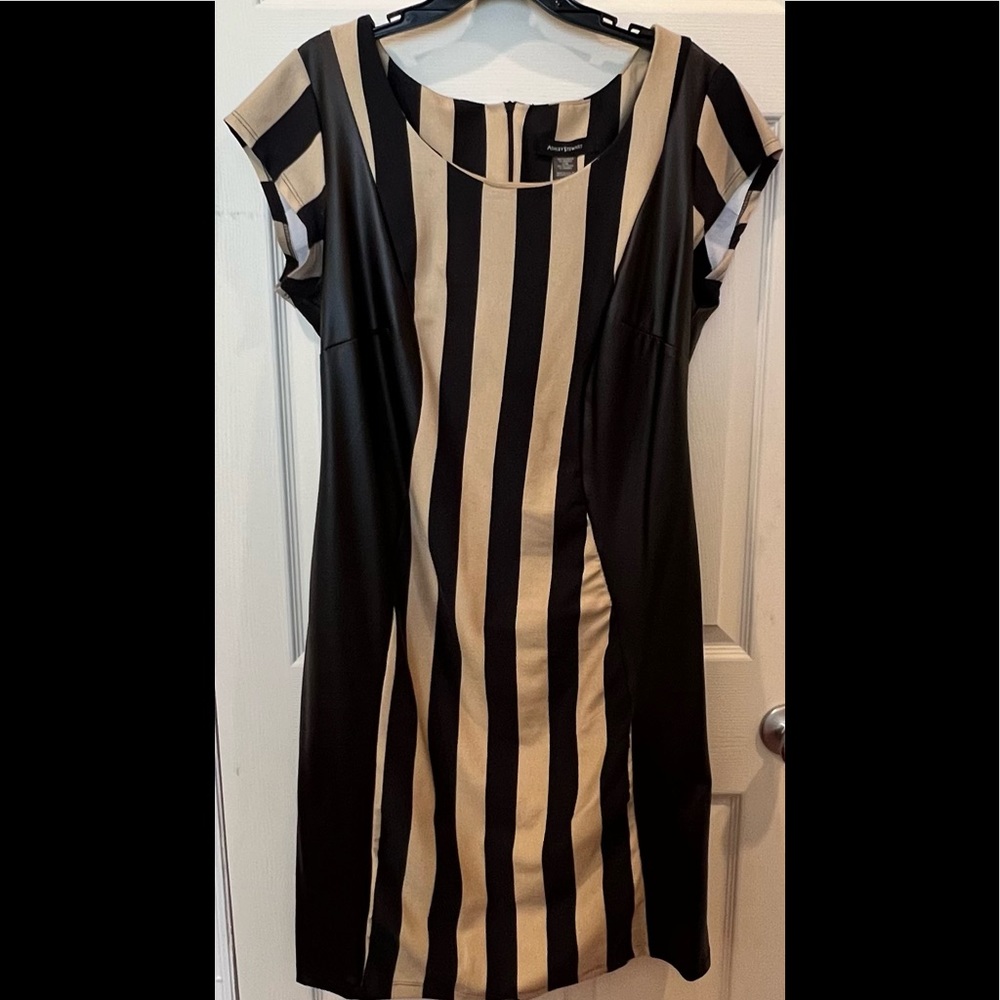 Black and beige striped knit dress with faux leather side panels.